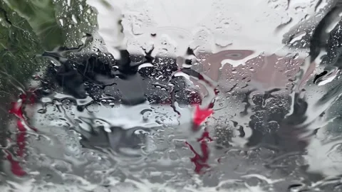Beautiful window with rain falling on it Stockbeeldmateriaal 299709917