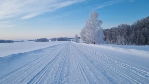 Beautiful winter landscape with a country road covered in snow. Stock Footage 327121853
