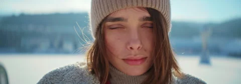 This is a beautiful Winter Portrait set against a serene Snowy Landscape Stock Footage 314545143