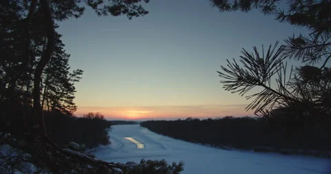 Beautiful winter snowy landscape while sunset. Beautiful view of a wide froze Stock Footage 166201033