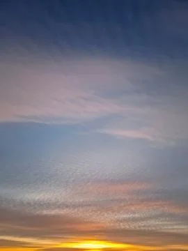Beautiful winter sunset sky background. Colorful dusk clouds Stock Photos