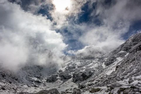 Beautiful winter view with dramatic clouds at the Rila mountain in Bulgaria, Stock Photos