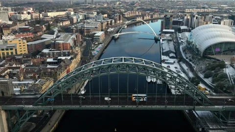 Beautiful winterry slow Pull back over Newcastle Tyne Bridge to reveal Stock Footage 257649143