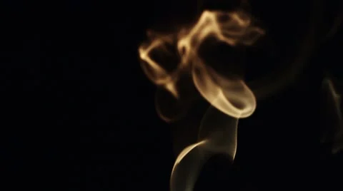 Beautiful wisp of smoke on a black background. Warm tone Vidéo 67824514