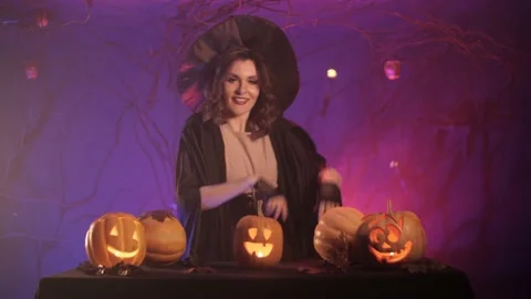 Beautiful witch dancing for halloween Stock Footage 163752600