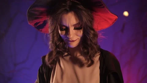 Beautiful witch preparing for halloween Stock Footage 163752443