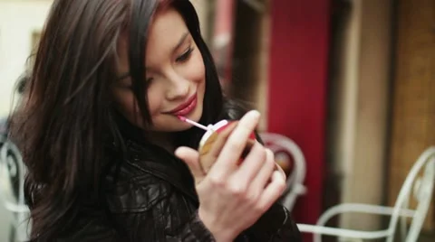 Beautiful woman applying beauty make-up in the city, steadicam shot HD Stock Footage