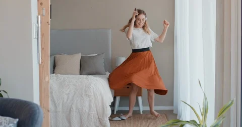 Beautiful woman dancing at home having fun celebrating lifestyle achievement Stock Footage