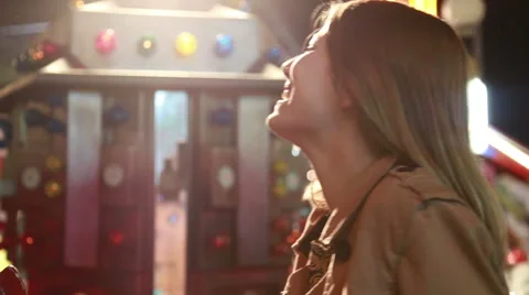 Beautiful woman having fun in amusement park, waving to the camera Stock Footage 59556265