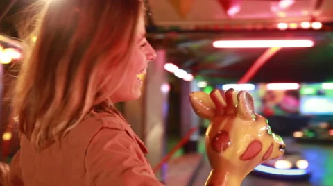 Beautiful woman having fun riding carousel in amusement park Stock Footage 59556221