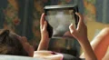 beautiful woman is having fun with the tablet HD Footage