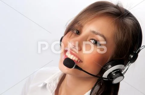 Beautiful woman with headset smiling Stock Photos