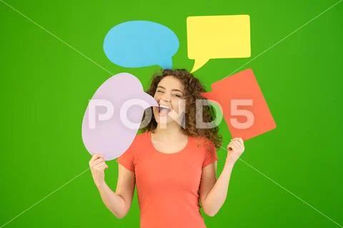 The beautiful woman hold a dialog signs on the green background Stock Photos