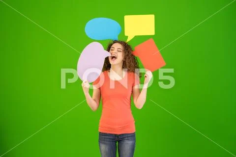 The beautiful woman hold a dialog signs on the green background Stock Photos