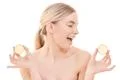 The beautiful woman holding a lemon on the white background Photo