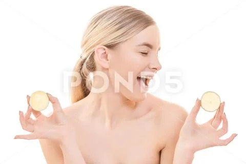 The beautiful woman holding a lemon on the white background Stock Photos