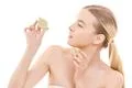 The beautiful woman holding a lime on the white background Photo