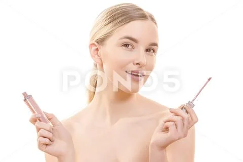 The beautiful woman holding a lip gloss on the white background Stock Photos