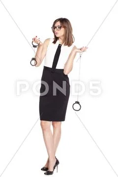 Beautiful woman holding two pairs of handcuffs Stock Photos