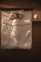 The beautiful woman lay on the bed and gesture. View from above Photo