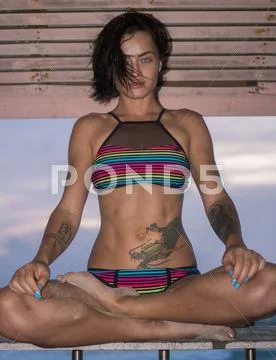 Beautiful woman in lifeguard tower on the beach Stock Photos