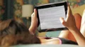 beautiful woman in lingerie surfing in the internet with the tablet to shop HD Footage