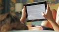 beautiful woman in lingerie surfing in the internet with the tablet to shop HD Footage