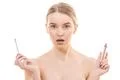 The beautiful woman with a lip gloss on the white background Photo