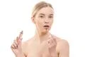 The beautiful woman with a lip gloss on the white background Photo
