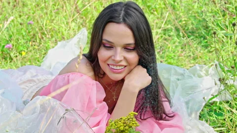 Beautiful woman looking at camera while Glowing Particles Flying Stock Footage 159129255