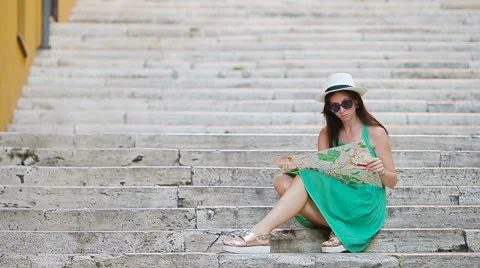 Beautiful woman looking at touristic citymap in Rome, Italy. Happy girl enjoy Stock Footage