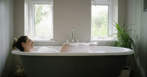 https://images.pond5.com/beautiful-woman-lying-bathtub-enjoying-footage-073365434_iconl.jpeg