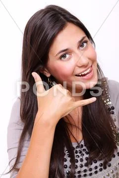 Beautiful woman making a call me gesture Stock Photos