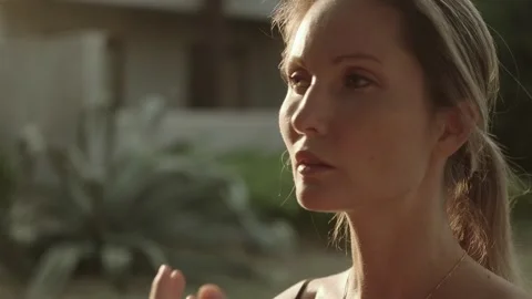 A beautiful woman moves gracefully while doing breathing and movement Stock Footage 257670394