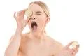 The beautiful woman with an open mouth and a lime on the white background Photo