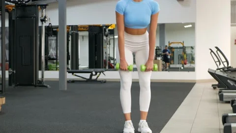 A beautiful woman performs the exercise Stock Footage 163147567