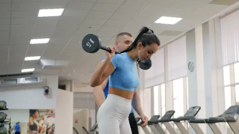 A beautiful woman performs the exercise Video stock 163147997