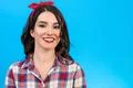 The beautiful woman portrait on the blue background Photo