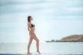 The beautiful woman pose against the background of the sea Photo
