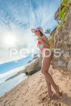 The beautiful woman pose on the beach Stock Photos