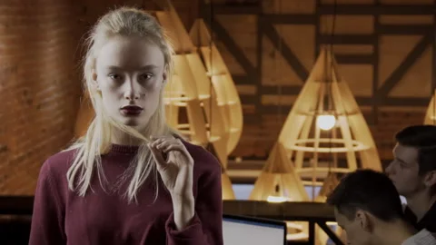 Beautiful woman is posing while standing in trendy place. Stock Footage 86560936