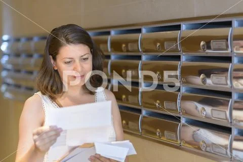Beautiful woman reading correspondence Stock Photos