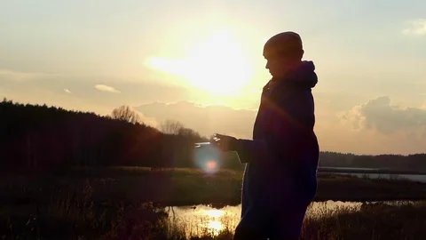 Beautiful Woman is Reading Some Booklet at Sunset in Early Spring in Eastern Stock Footage