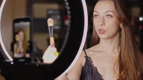 Beautiful woman recording makeup tutorial sharing online beauty video class Stock Footage 143439762