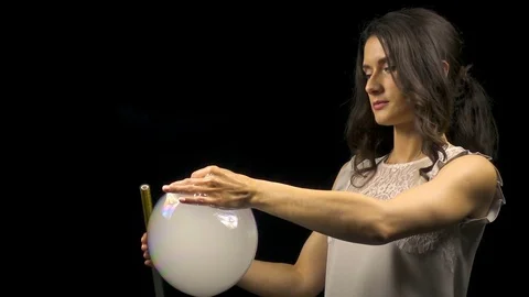 Beautiful woman releasing smoke from soap bubble Stock Footage