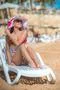 The beautiful woman rest on the beach Photo