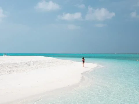 Beautiful Woman Run on the Maldivian Beach. Stock Photos