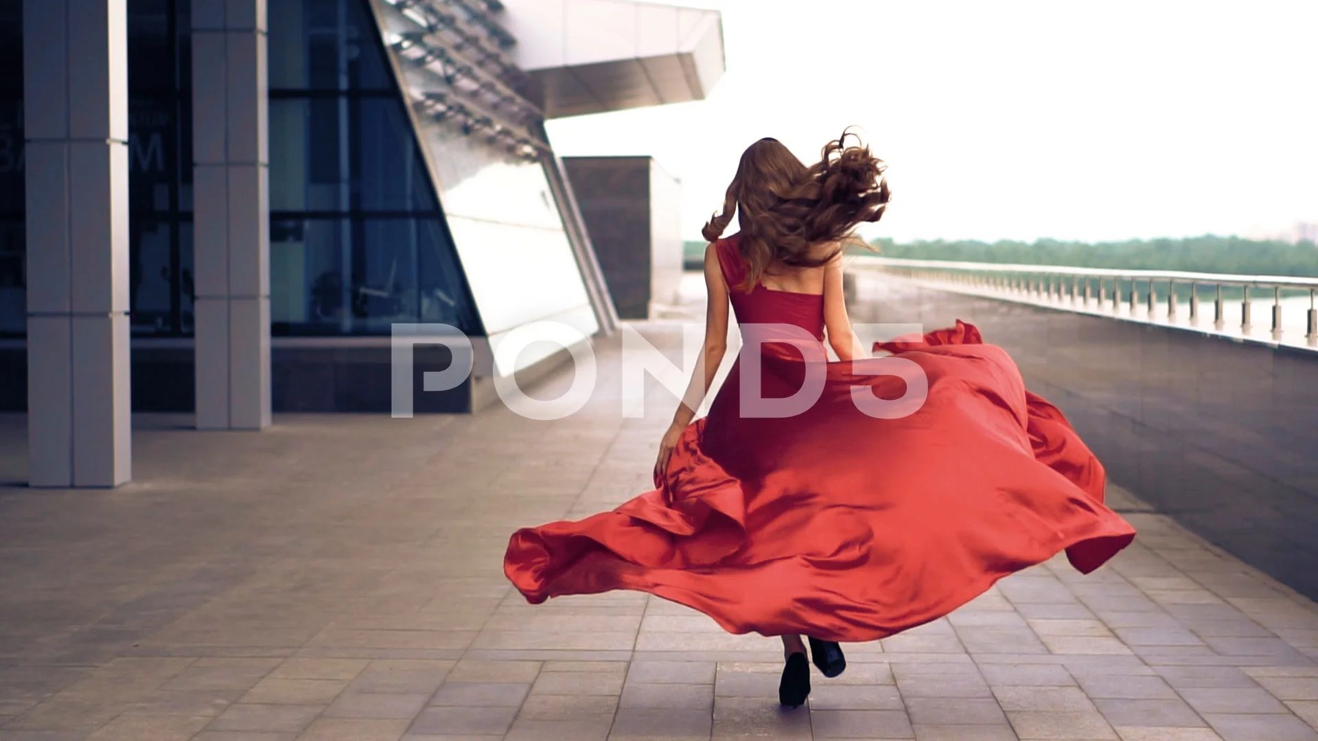 woman in red dress running