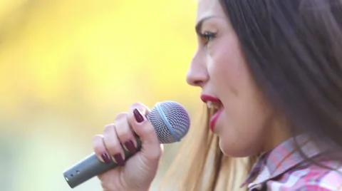 Beautiful woman singing Stock Footage 59556703