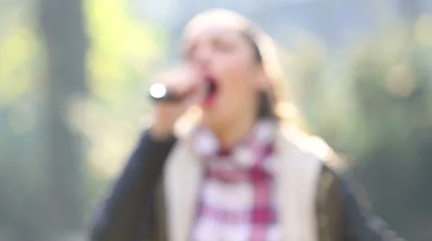 Beautiful woman singing with the microphone Stock Footage 59556569